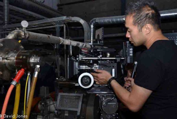 Cameraman making adjustments
