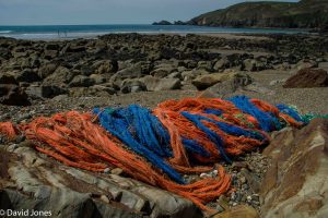 Discarded fishing nets on a beach in Wales