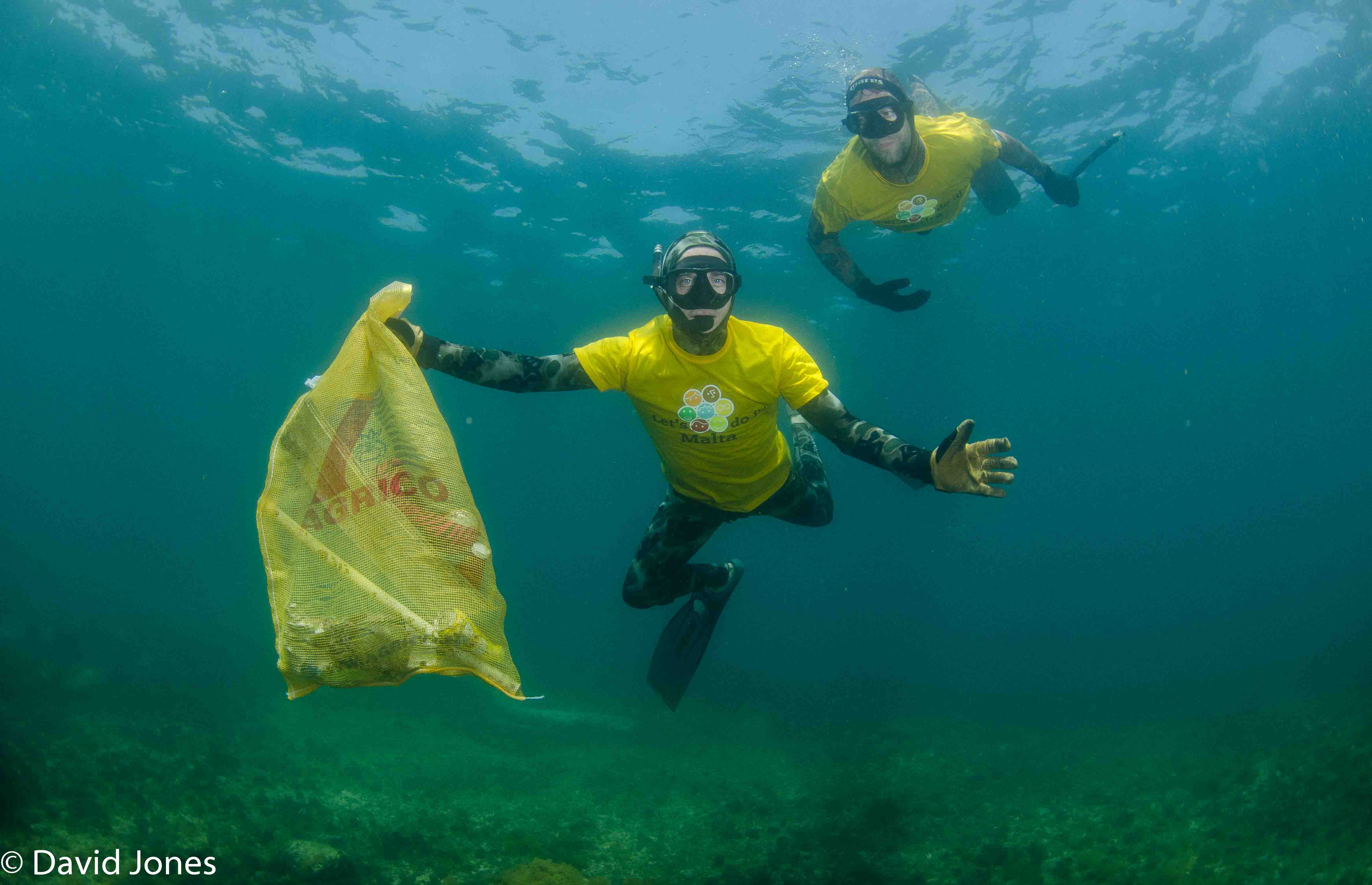 Freedivers collecting plastic waste
